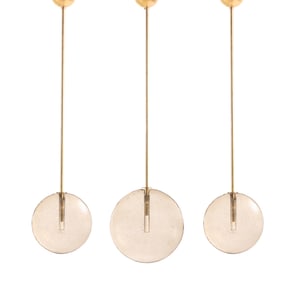 A SET OF THREE MURANO GLASS DISC PENDANT LIGHTS HAVING BRASS POST AND CANOPY.