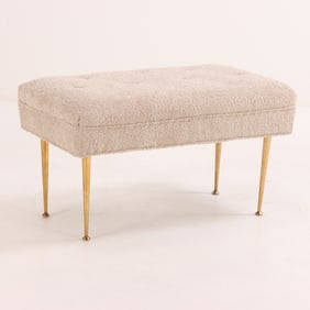 ITALIAN UPHOLSTERED BENCH RESTING ON BRASS LEGS C 1950 HAVING NEW FABRIC.