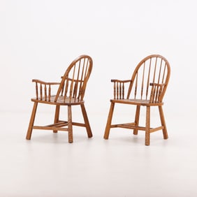 RARE PAIR OF GOUGE CARVED OAK WINDSOR CHAIRS WITH RUSH SEATS ATTRIBUTED TO JEAN-MICHEL FRANK.