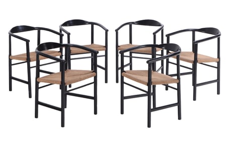SET OF SIX EBONIZED WOOD AND RUSH SEAT DINING CHAIRS WITH CURVED BACKS.