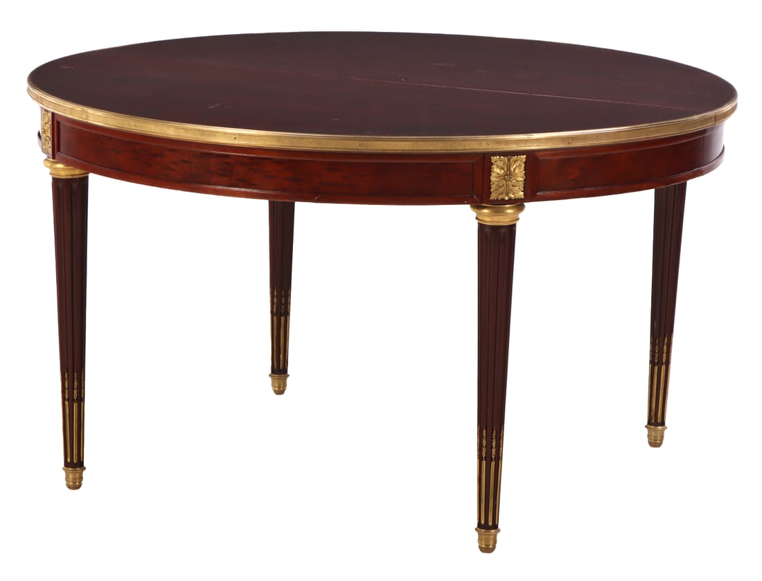 A JANSEN STYLE FLAME MAHOGANY DINING TABLE HAVING FLUTED LEGS AND ELABORATE BRONZE TRIM WITH ONE40. (1 of 6)