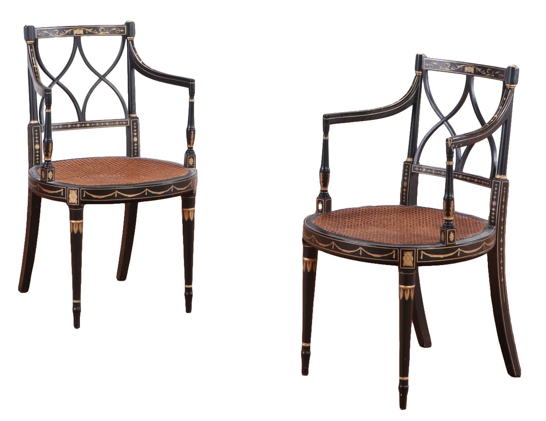 A PAIR OF NINETEENTH CENTURY ENGLISH REGENCY STYLE GILT AND EBONIZED CANE OPEN ARM CHAIRS WITH LOOSE (1 of 9)