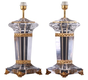 A PAIR OF LARGE ACRYLIC LAMPS WITH BRASS DECORATION IN THE NEOCLASSICAL TASTE.