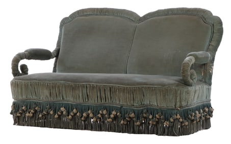 A FRENCH TURKISH STYLE NAPOLEON III SETTEE HAVING HAVING SCROLL FORM OPEN ARMS AND TASSLE AND TRIM