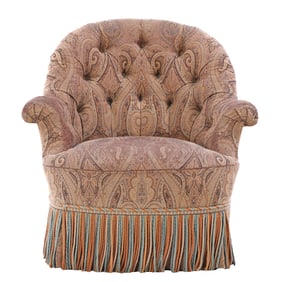 NINETEENTH CENTURY FRENCH LOUNGE CHAIR HAVING EBONIZED TURNED FEET AND FRINGE DECORATION.