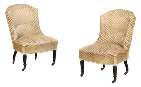 A PAIR OF FRENCH NAPOLEON III STYLE SLIPPER CHAIRS HAVING TURNED AND EBONIZED LEGS C 1860.