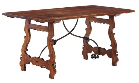 A 18TH CENTURY SPANISH CARVED MAHOGANY TABLE HAVING WROUGHT IRON STRETCHER.