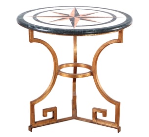 MARBLE TOP TABLE HAVING AN INLAID TOP RESTING ON A GILT IRON BASE.