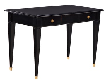 AN EBONIZED TWO DRAWER FRENCH DESK HAVING TAPERED LEGS AND BRONZE TRIM CIRCA 1950.