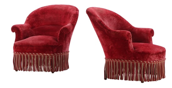 PAIR OF NAPOLEON III NINETEENTH CENTURY LIBRARY CHAIRS RESTING ON EBONIZED TURNED FEET.