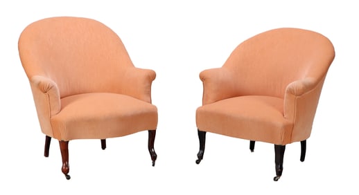 PAIR OF NINETEENTH CENTURY LOUNGE CHAIRS RESTING ON SHAPED WALNUT FEET,