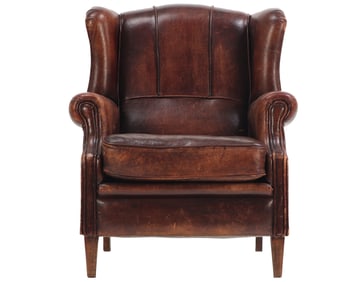 VINTAGE LEATHER WING CHAIR C 1945 WITH BRASS NAIL TRIM.