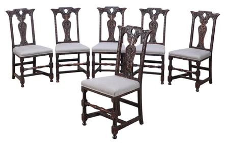 A SET OF SIX NINETEENTH CENTURY ENGLISH CARVED MAHOGANY DINING CHAIRS.