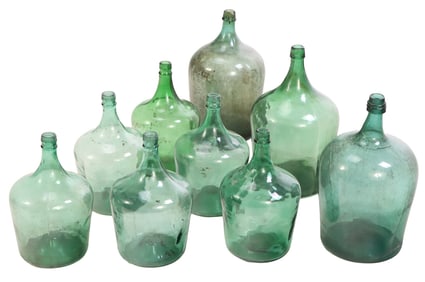 A COLLECTION OF BLUE-GREEN GLASS DEMIJOHN BOTTLES