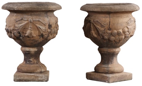 PAIR OF CAST SANDSTONE GARDEN RRNS HAVING FLORAL SWAG DECORATION.
