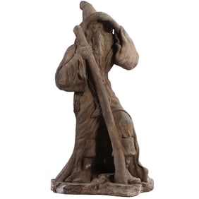 A CAST SANDSTONE GARDEN WIZARD.