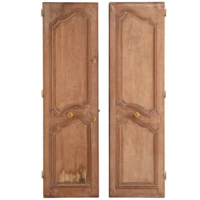 A PAIR OF ANTIQUE CARVED OAK FRENCH DOORS.