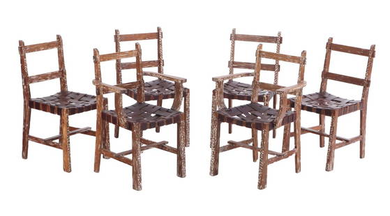 SIX RUSTIC CERUSED OAK AND STRAP WORK LEATHER CHAIRS INCLUDING TWO ARM CHAIRS C 1940.: Six rustic cerused oak and strap work leather chairs including two arm chairs C 1940. Armchairs Ht: 35" Wd: 17.5" Dpth: 19.5" Seat: 18.5" Ht: 35.25" Wd: 23.5" Dpth: 20.75" Seat: 18"