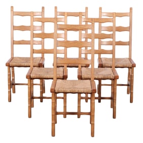 SIX FRENCH OAK AND RUSH BRUTALIST STYLE DINING CHAIRS HAVING SHAPED BACKS AND LEGS C 1945.