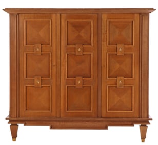 A FRENCH THREE DOOR OAK CABINET WITH BRONZE STAR DECORATION IN THE MANNER OF ANDRE ARBUS C 1950.