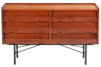 SIX DRAWER DRESSER RESTING ON AN IRON BASE C 1960.