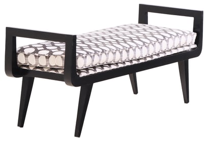 AN EBONIZED WOOD AND UPHOLSTERED WINDOW BENCH WITH RECENT FABRIC.