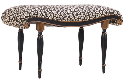 EBONIZED AND GILTWOOD UPHOLSTERED BENCH C 1950 HAVING A SHAPED AND CARVED FRAME.