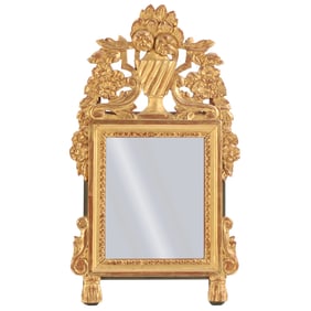 A SMALL FRENCH EIGHTEENTH CENTURY CARVED AND GILTWOOD MIRROR.