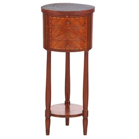 A ROUND INLAID TABLE HAVING THREE DRAWERS AND AN INSET MARBLE TOP C 1900.