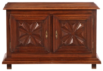 A NINETEENTH CENTURY LOW FRENCH TWO DOOR WALNUT CABINET WITH GEOMETRIC MOTIFS.