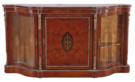 CONTINENTAL BURL WALNUT AND INLAID BRONZE MOUNTED CREDENZA HAVING SERPENTINE GLASS DOORS C 1900.