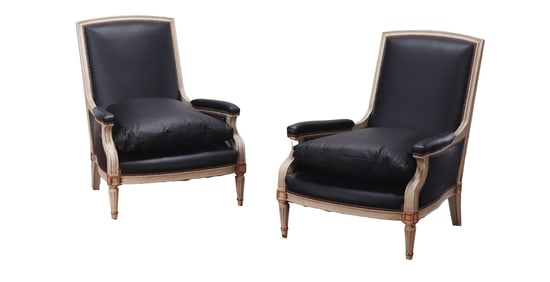 PAIR OF PAINTED AND GILTWOOD LOUNGE CHAIRS IN BLACK LEATHER C 1940 IN THE MANNER OF JANSEN.
