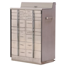 ART DECO STYLE DENTAL CABINET HAVING A LAMINATE TOP AND SIDES, STEEL DRAWER FACES AND IRON DRAWER
