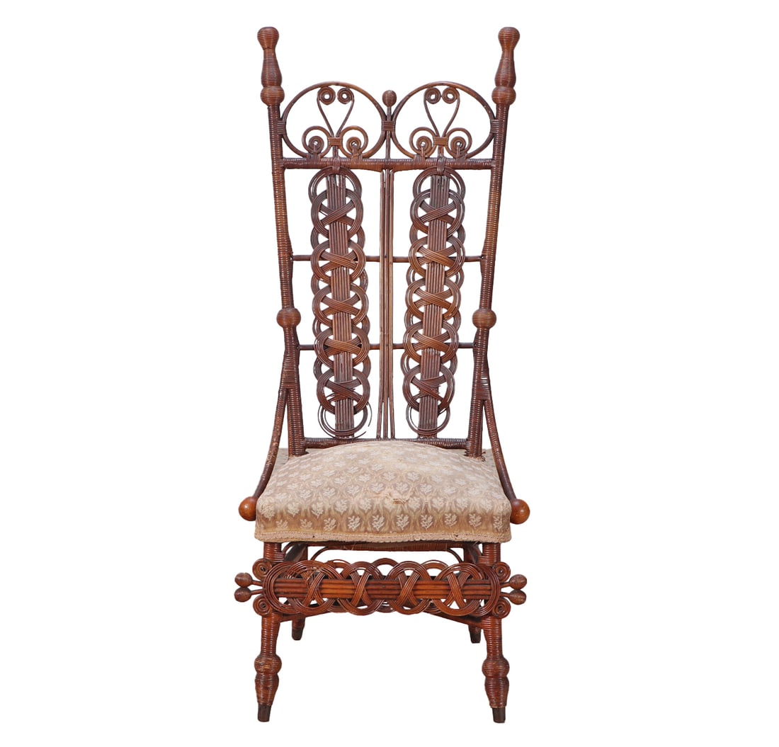 A HEYWOOD WAKEFIELD ATTRIBUTED WICKER CHAIR WITH UPHOLSTERED CUSHION CIRCA 1890.: A Heywood Wakefield attributed wicker chair with upholstered cushion circa 1890. Ht: 46.25" Wd: 21" Dpth: 22.25" Seat: 18"