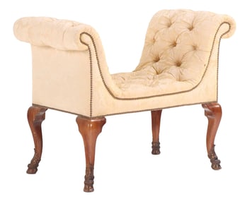 SMALL CARVED WALNUT UPHOLSTERED WINDOW BENCH HAVING HOOVED FEET C 1950.