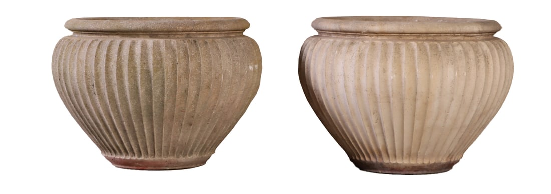 A PAIR OF RIBBED CAST STONE GARDEN PLANTERS. (1 of 6)