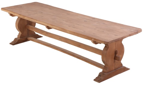 A LARGE CONTINENTAL OAK FARM TABLE HAVING A THICK TOP AND STRETCHER BASE