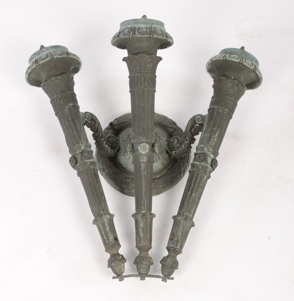 CLASSICAL BRONZE ARCH. SCONCE 3 TORCH ARMS: A very good classical bronze architectural sconce having three torch form arms circa 1890. Supported on acanthus leaf brackets and laurel wreath decorated back plate. Ht: 20" Width: 20" Depth: 11"
