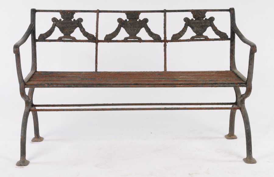 CLASSICAL CAST IRON GARDEN BENCH: A good classical cast iron garden bench having urn and garland decorated seat back over downswept arms and open seat circa 1900. Supported on curule base. Ht: 30" Width: 48.5" Depth: 18.5"