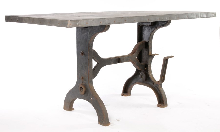 INDUSTRIAL ZINC TOP TABLE ANTIQUE CAST IRON BASE: An industrial zinc top table supported on an antique cast iron matching base circa 1910 and later. Ht: 36.5" Width: 72" Depth: 36"