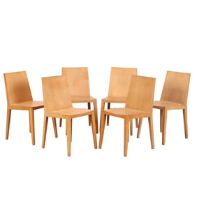 SIX FRENCH OAK DINING CHAIRS IN THE MANNER OF JEAN -MICHEL FRANK C 1990.