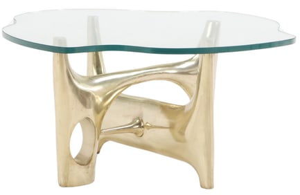 HEAVY BRASS BIOMORPHIC TABLE HAVING A THICK SHAPED GLASS TOP IN THE MANNER OF PHILIPPE HIQUILY