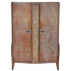 FRENCH TWO DOOR CERUSED OAK ARMOIRE IN THE MANNER OF ARBUS C 1945. CENTRAL MIRROR IS ORIGINAL AND