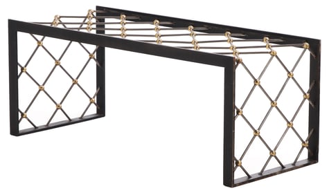 A SUBSTANTIAL BRONZE AND IRON COFFEE TABLE HAVING A GLASS TOP IN THE MANNER OF JEAN ROYERE.