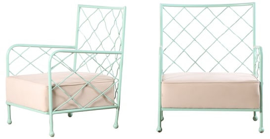 PAIR PAINTED IRON ARM CHAIRS WITH LOOSE CUSHIONS IN THE MANNER OF JEAN ROYERE.