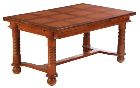 FRENCH OAK DINING TABLE HAVING TWO LEAVES AND BALL FEET IN THE MANNER OF CHARLES DUDOUYT C 1940.