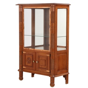 FRENCH OAK TWO DOOR CABINET HAVING COPPER PLATED BRASS DOOR AND GEOMETRIC MOTIFS IN THE MANNER OF