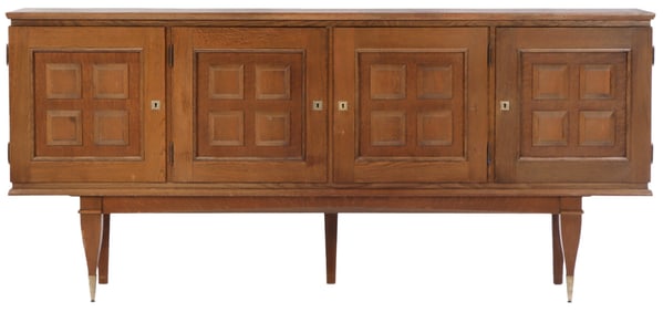 FRENCH FOUR DOOR OAK SIDEBOARD C 1940. ONE OF TWO IDENTICAL PIECES IN THIS SALE.