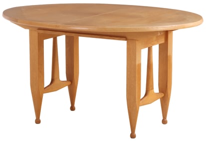FRENCH OAK DINING TABLE HAVING AN OVAL TOP WITH TWO ORIGINAL LEAVES BY GUILLERME AND CHAMBRON C