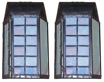 PAIR OF IRON LANTERNS HAVING BLUE LEADED GLASS FRONT PANELS AND INTERESTING BUBBLE GLASS SIDE